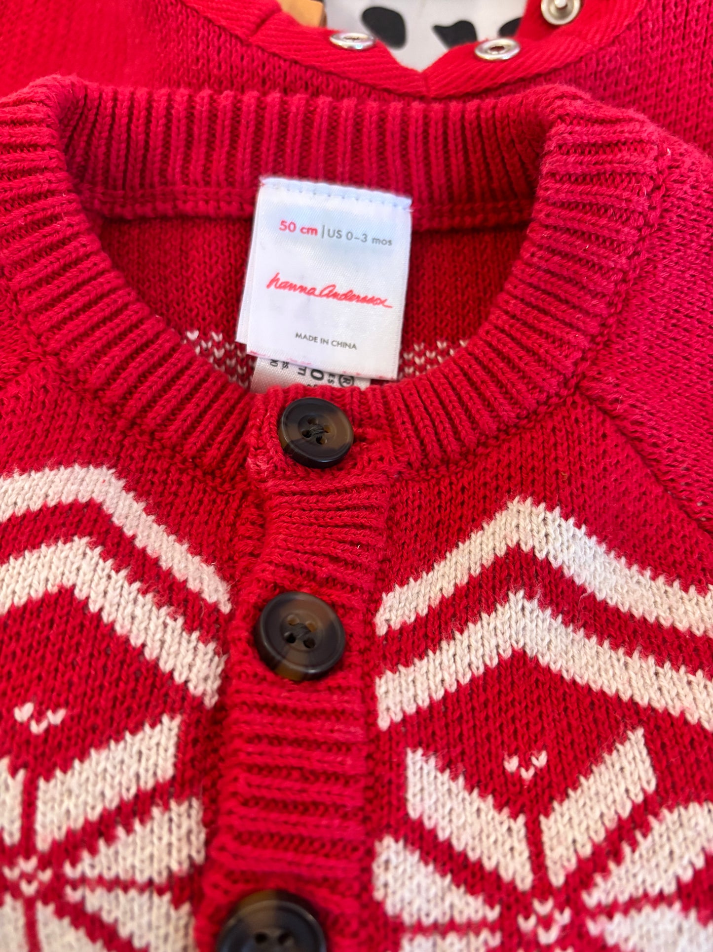 Hanna Andersson red and white knit romper. Snap closure and buttons. Size 0-3m / NB