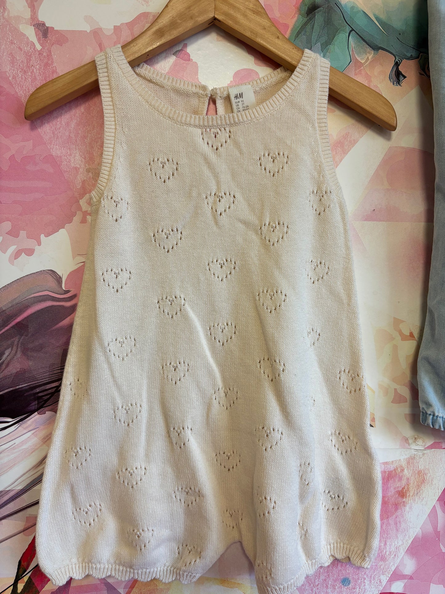 2 H&M rompers. Cream knit sleeveless with hearts and scalloped hem. Light blue denim adjustable overalls. Both size 2T