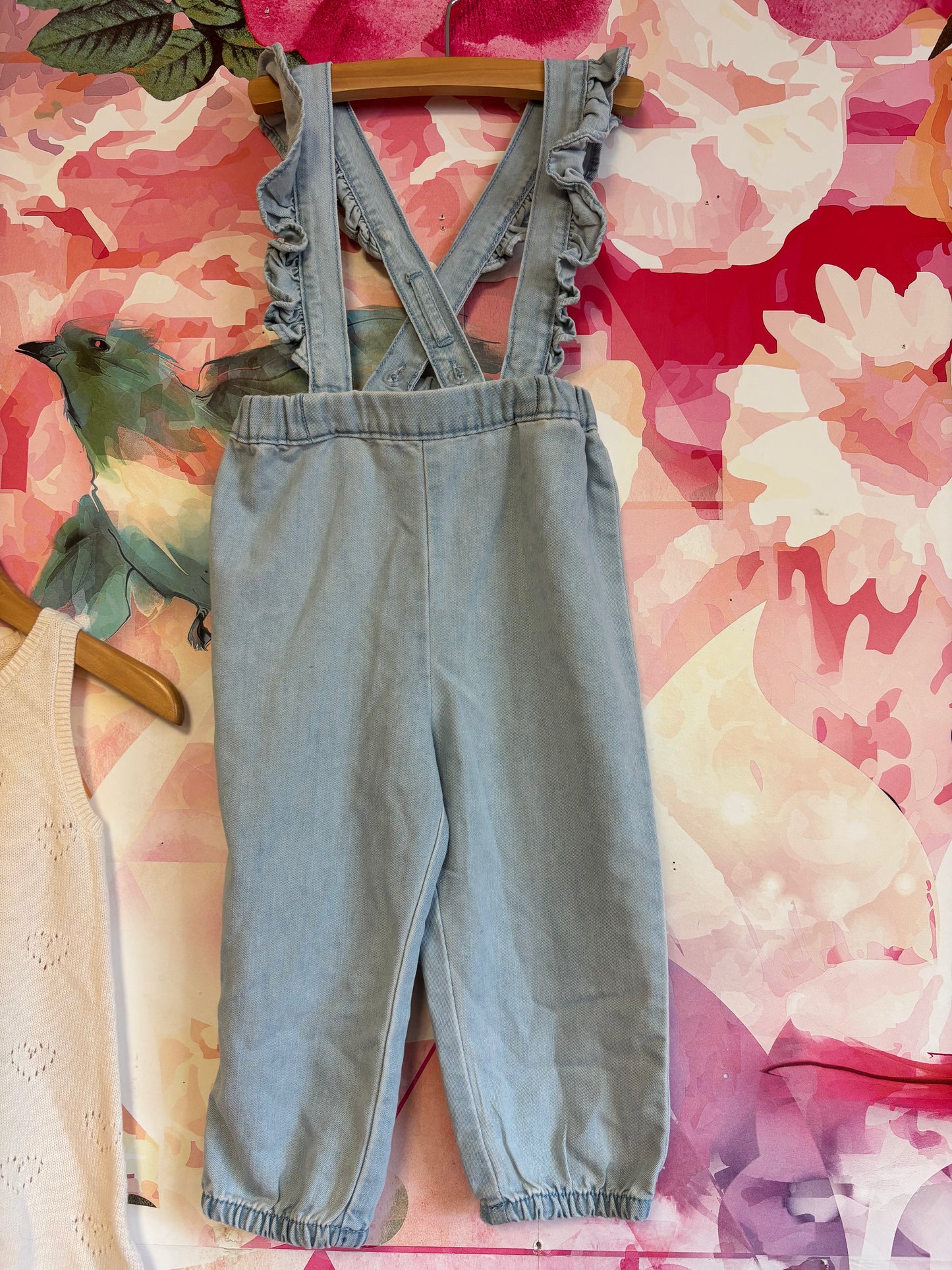 2 H&M rompers. Cream knit sleeveless with hearts and scalloped hem. Light blue denim adjustable overalls. Both size 2T