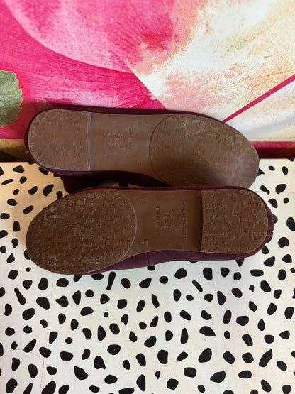 Elephantito purple suede leather Melissa flats. Luxe comfort ballerina shoe that features crossed stretch ankle straps for a secure fit. Lightly padded footbed leather outsole & lining. Size 3.