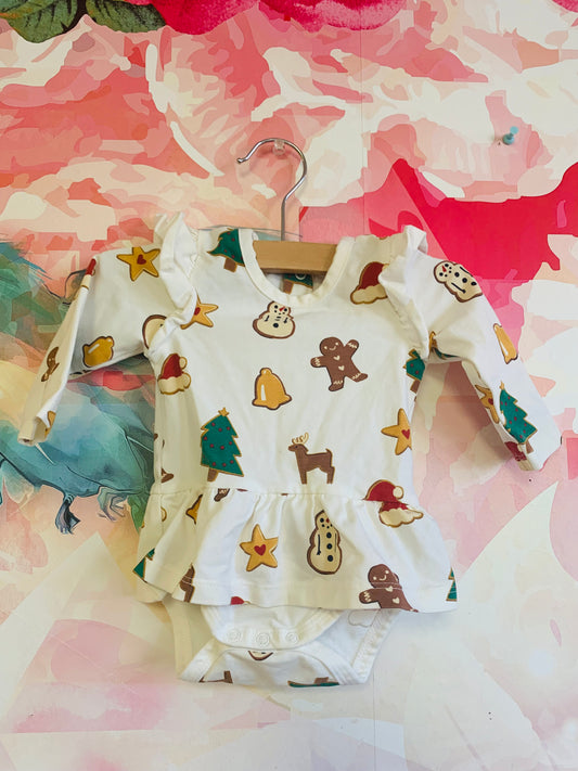 Monica & Andy cream long sleeve onesie with skirt. Holiday design with gingerbread cookies bells Xmas trees. Size 0-3m.