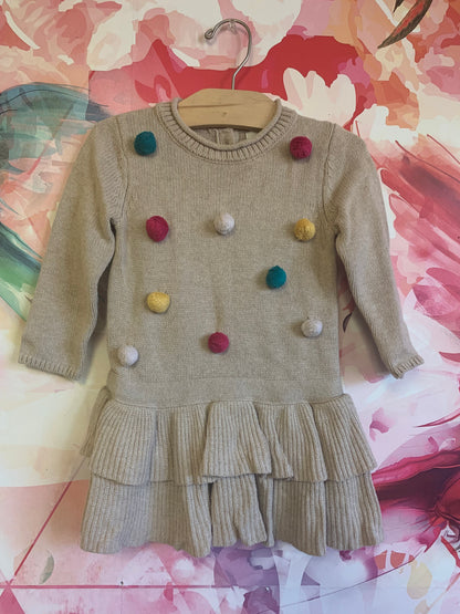 H&M Beige long sleeve knit dress with two tier ruffles and colorful Pom poms. Size 18m