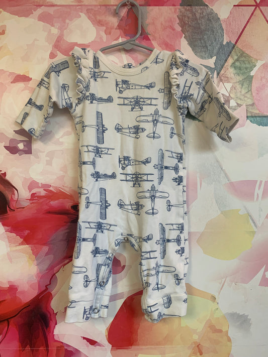 Kate Quinn cream romper with blue airplanes and shoulder ruffles. 100% organic cotton. Size 3-6m