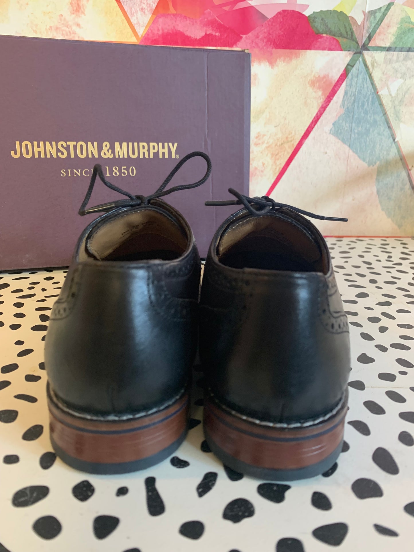 Johnston & Murphy black leather Conrad cap toe dress shoes. Size 3. Comes in original box.