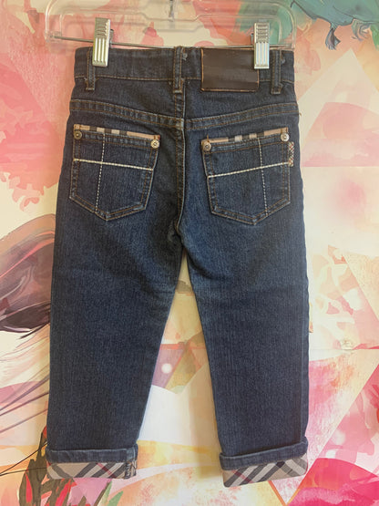 Burberry blue jeans with plaid rolled cuffs and detail on back pockets, inner waistband. Size 3/4T.