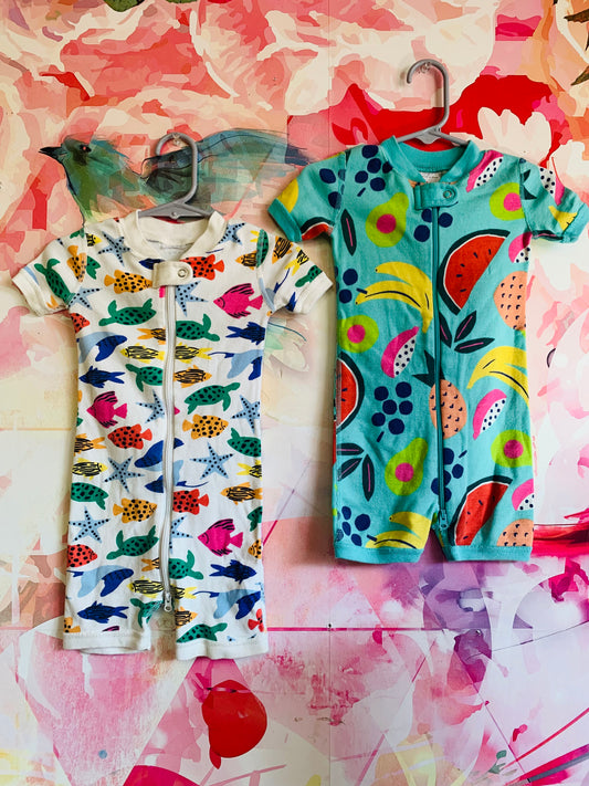 Two Hanna Andersson short sleeve rompers. Colorful fish & blue with colorful fruit. Size 12-18m