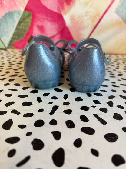 Mini Melissa Frozen shimmery blue shoes. Slight marking on one strap. See photo. Size 10.