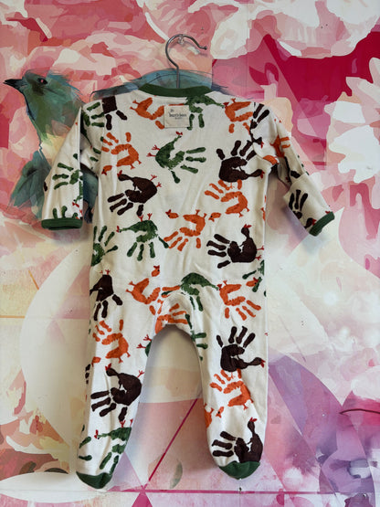 Burt’s Bees cream long sleeve romper with brown, green, orange handprint turkeys. Size 0-3m