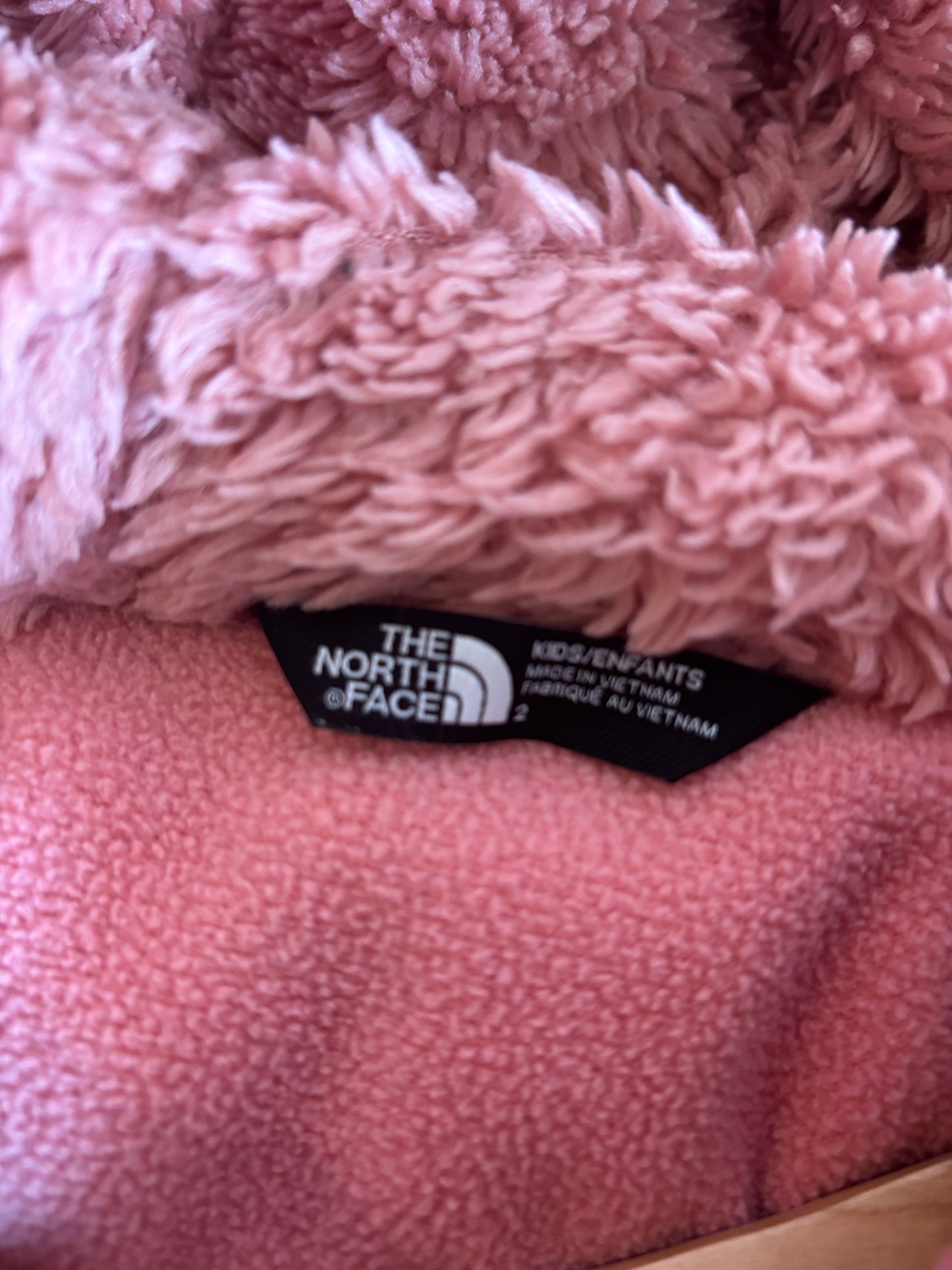 North Face pink fleece lined puffy coat with hood. Size 2 T.