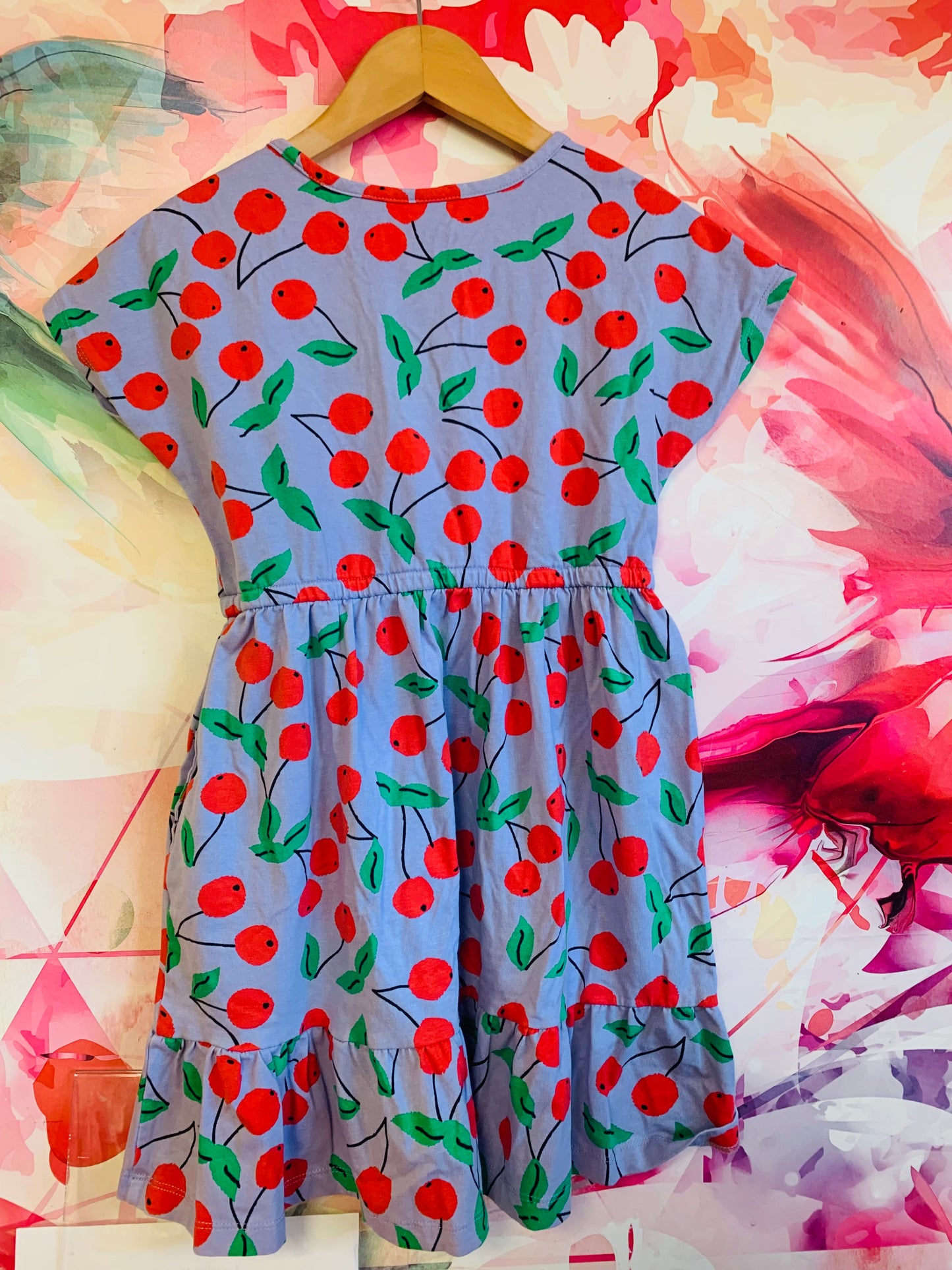 Hanna Andersson blue short sleeve dress with red & green cherries. Side pockets. Size 6/7.