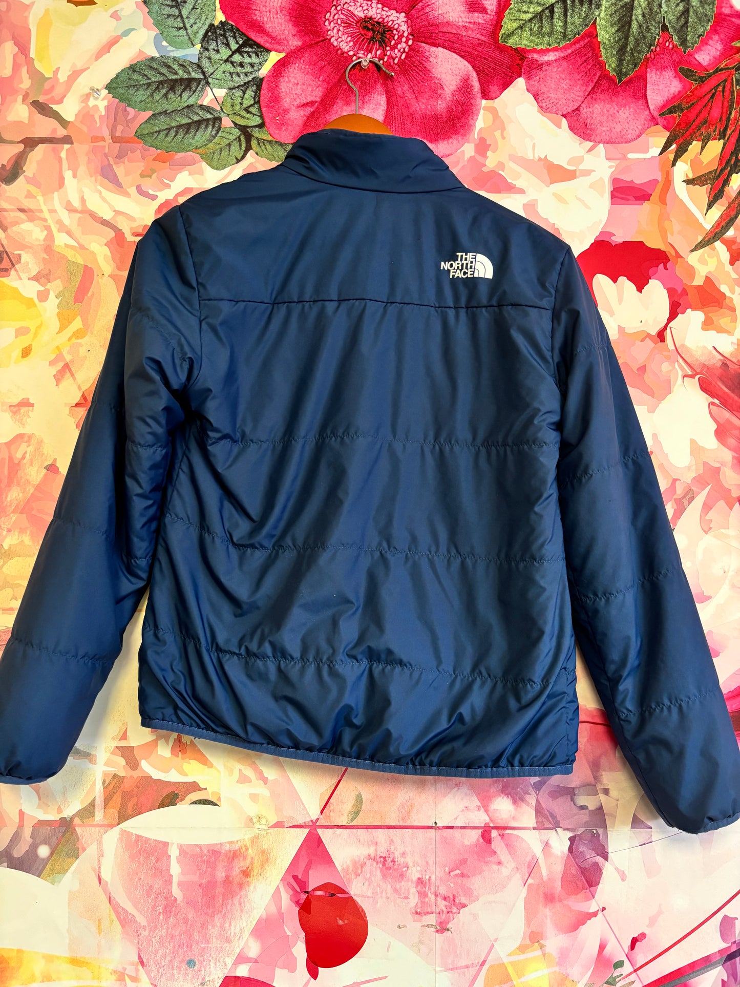 North Face blue reversible jacket with fleece inside. Size 14/16.