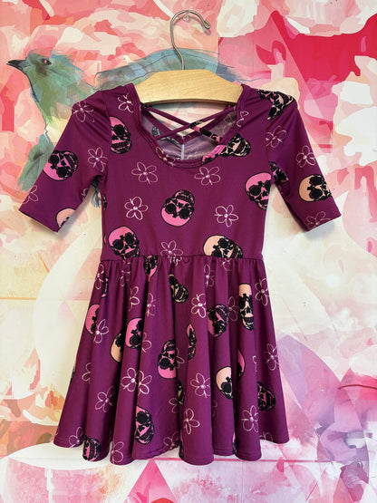 Dot Dot Smile purple short sleeve swing dress with flowers & skulls. Size 2T.