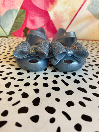 Mini Melissa Frozen shimmery blue shoes. Slight marking on one strap. See photo. Size 10.