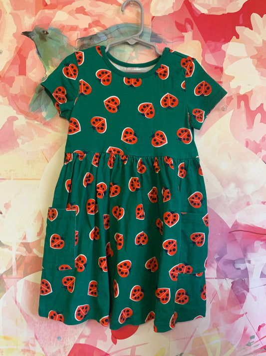 Hanna Andersson green short sleeve dress with red heart shaped ladybugs. Front pockets. Size 5