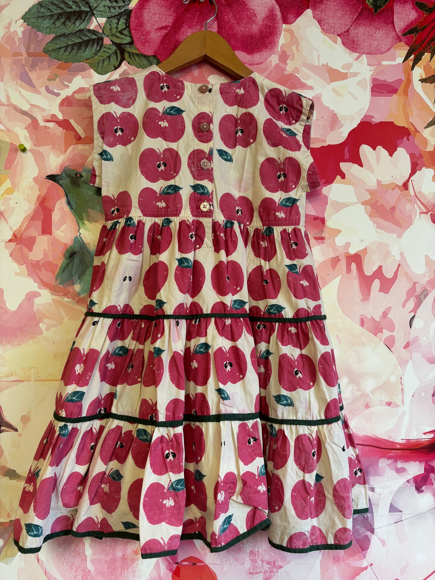 Pink Chicken apple stamp girls peachy dress. 100% cotton yarn dye. Cream, pink & green. Glitter buttons on back. Size 8