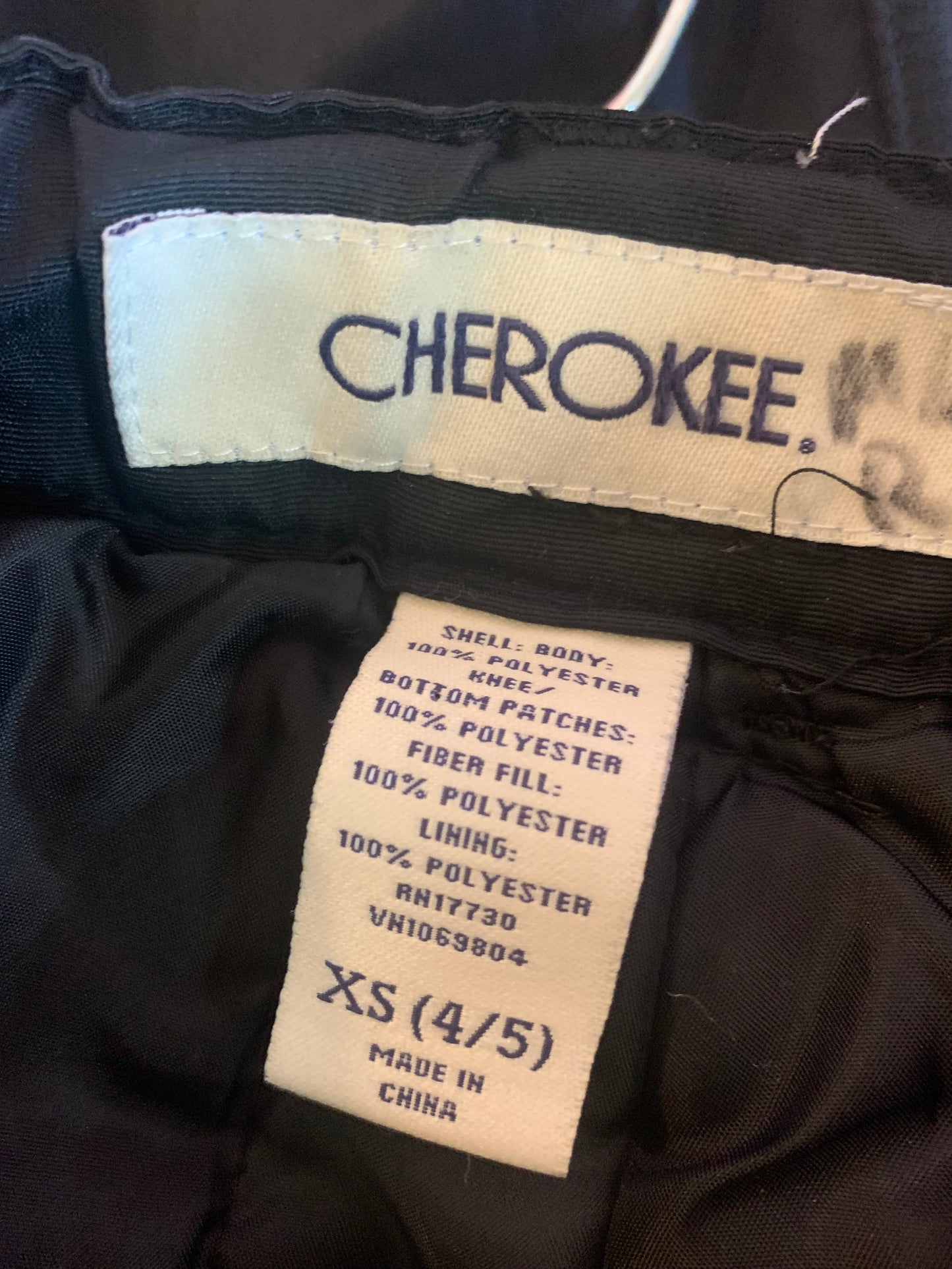 Cherokee black snow pants. Adjustable Velcro waist. Light wear on right knee (see second photo) size 4/5