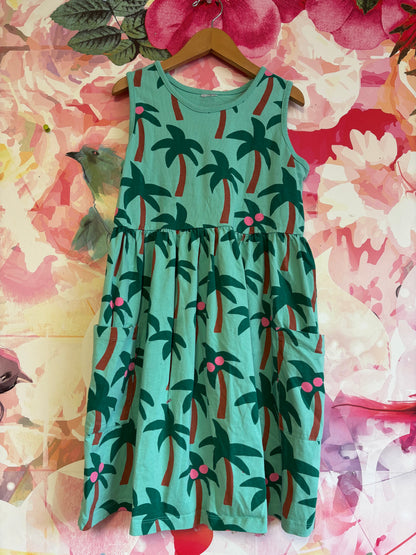 Green tank dress with palm trees, pink coconuts and front pockets. Size 12