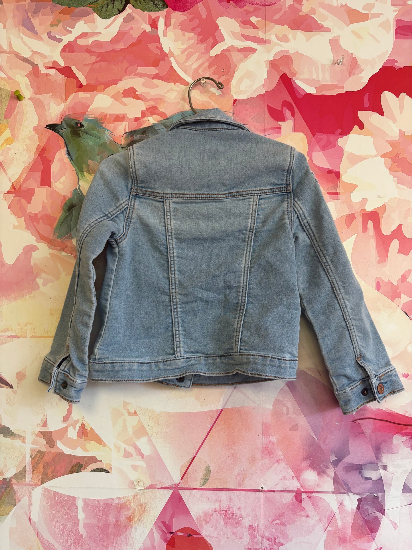 Baby Gap light blue denim jacket with sunflower and feather patches on sleeves. Snap closure. Size 5T