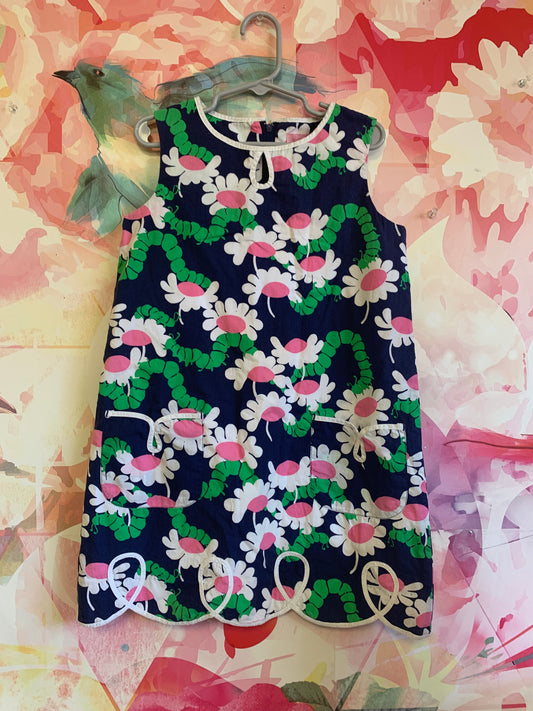 Lilly Pulitzer navy blue shift dress with white/pink flowers & green caterpillars. Front pockets and zipper back. Size 7