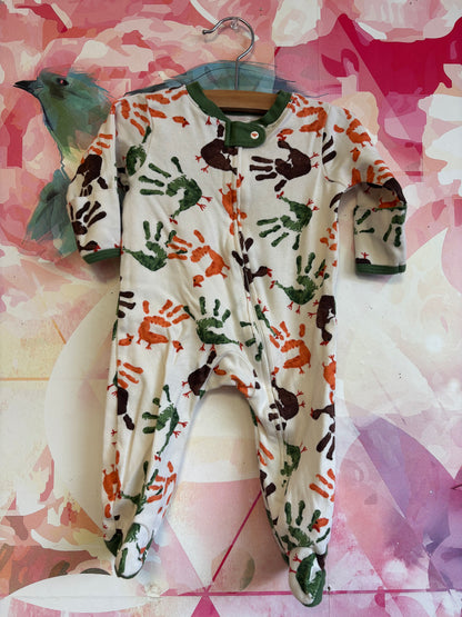 Burt’s Bees cream long sleeve romper with brown, green, orange handprint turkeys. Size 0-3m