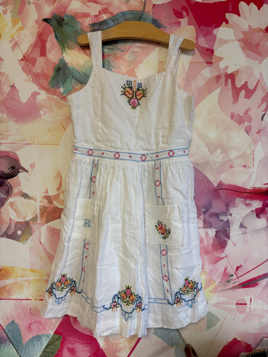 Ralph Lauren Polo Country white linen dress with pink, blue, yellow, green embroidery. Front pockets and buttons on back. Size 12.