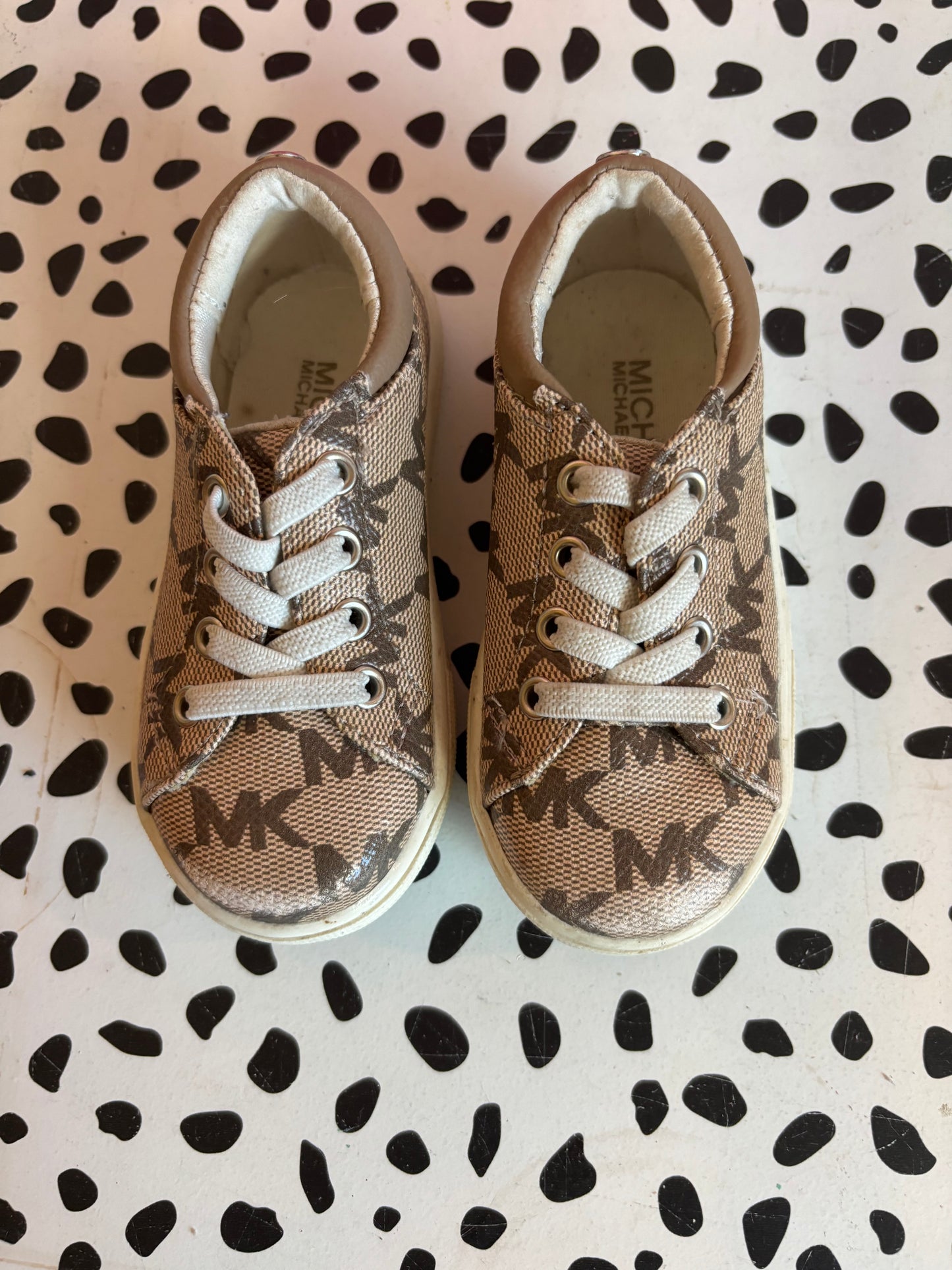 Michael Kors tan & cream slip on logo sneakers. Size 5.