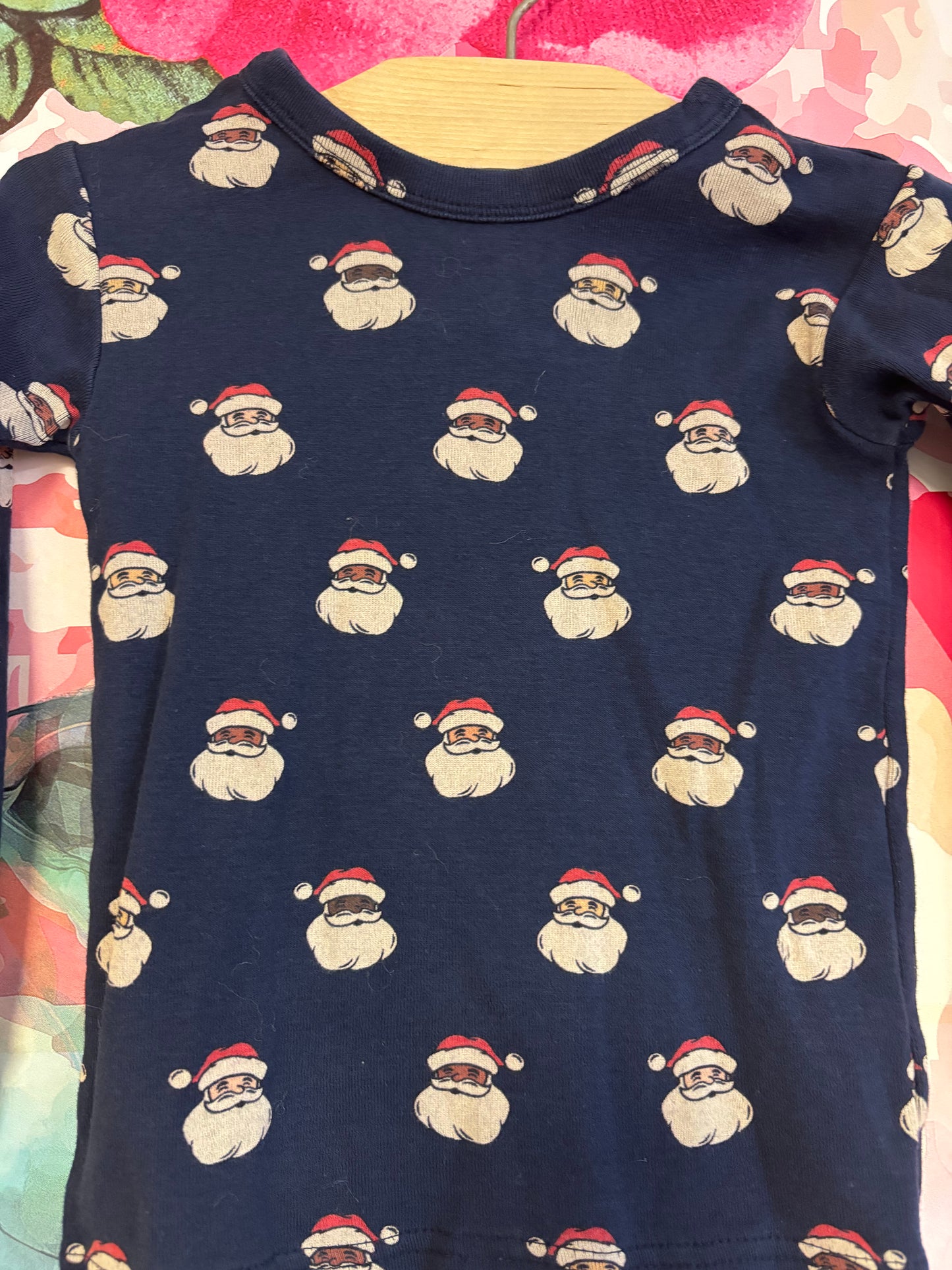 Baby Gap navy blue long sleeve pajamas with Santa faces. Size 3T.