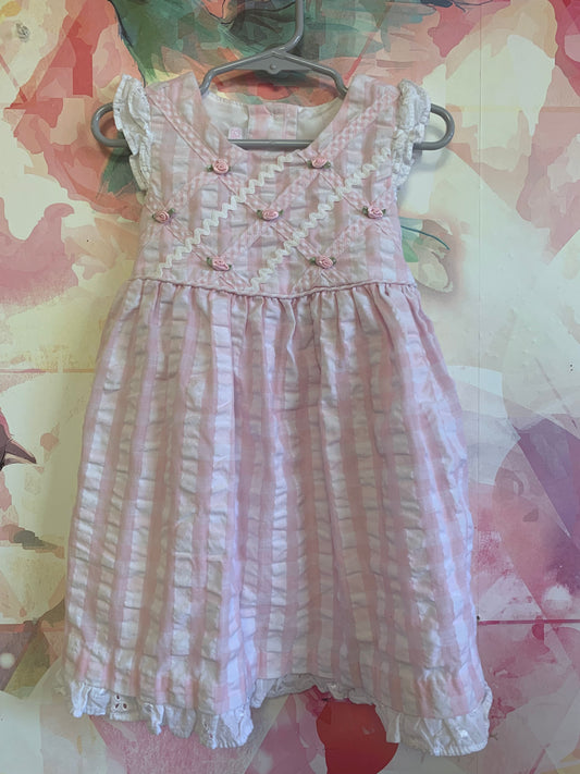 Bonnie Baby pink & white checkered sleeveless dress with Lacey trim on shoulders & hem. Tiny pink flowers, buttons & waist bow in back. Size 24m