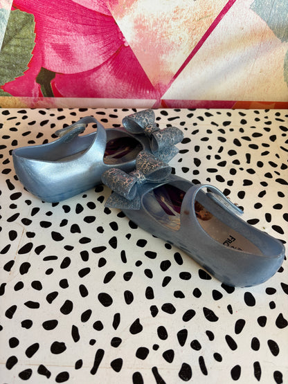 Mini Melissa Frozen shimmery blue shoes. Slight marking on one strap. See photo. Size 10.