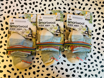 Smartwool kids’ hiking socks. *New in package*. Ankle height. Light cushion. Seamless. Elasticized arch brace, super breathable. Size L. Fits shoe size 3-6. 3 pairs. Price is per pair.