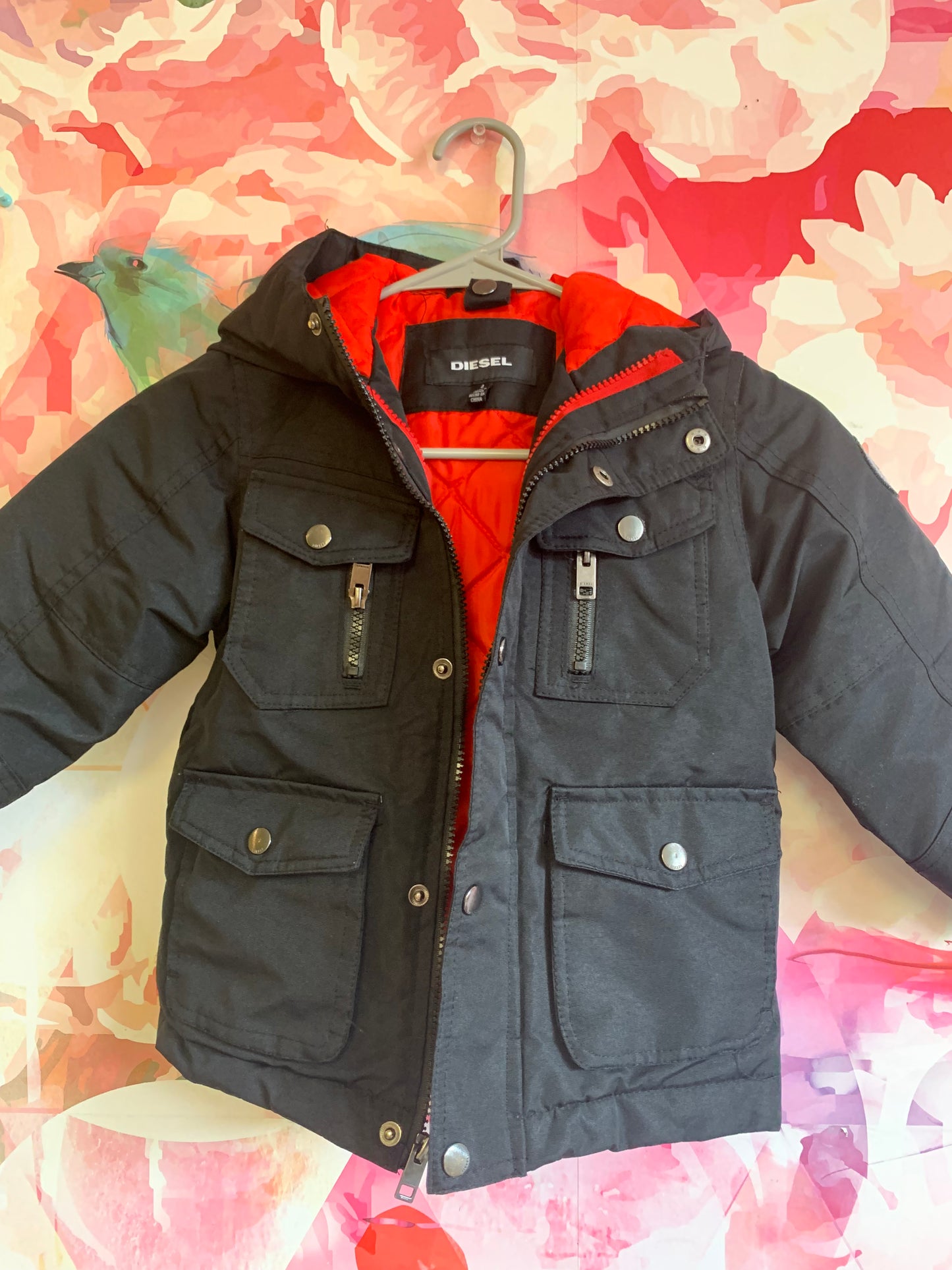 Diesel black winter coat with hood and red lining. Size 4T