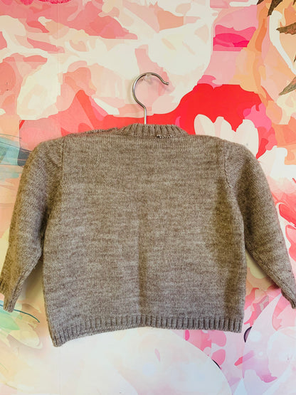 Light brown Fina Ejerique wool crewneck sweater with one front pocket. 9m.