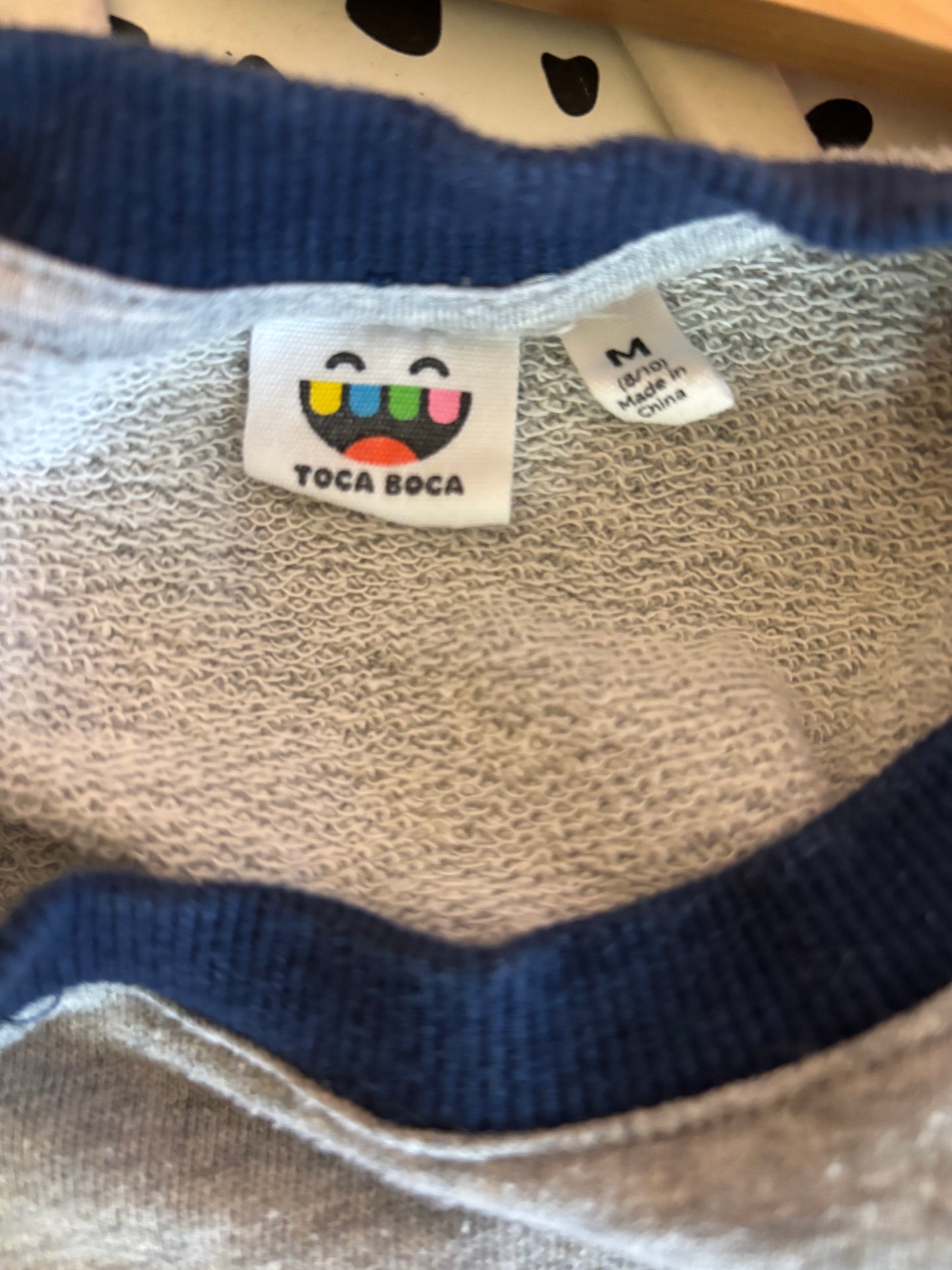 Toca Boca grey sweatshirt with embroidered orange cat singing to music. Size M (8/10)