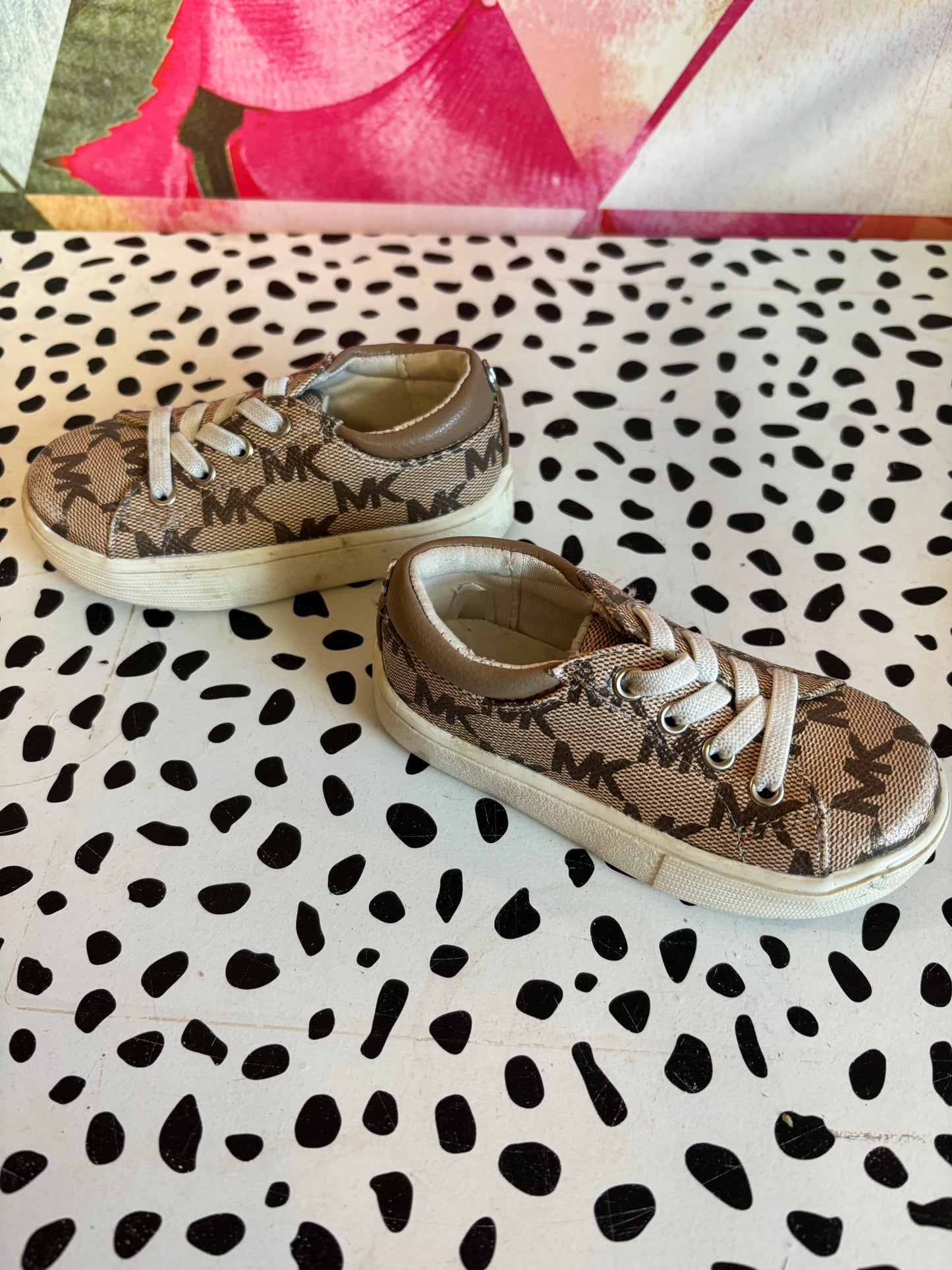 Michael Kors tan & cream slip on logo sneakers. Size 5.