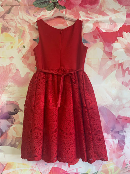 Emily West red sleeveless party dress. Shimmery top, tulle and lace skirt with red waist bow & jewels. Tie and zipper back. Size 8