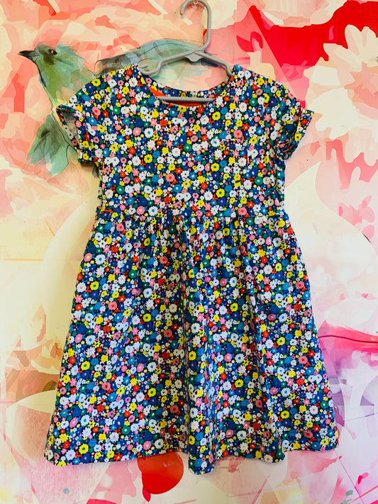 Mini Boden colorful bright flower dress with short sleeves and pockets. Size 5/6T