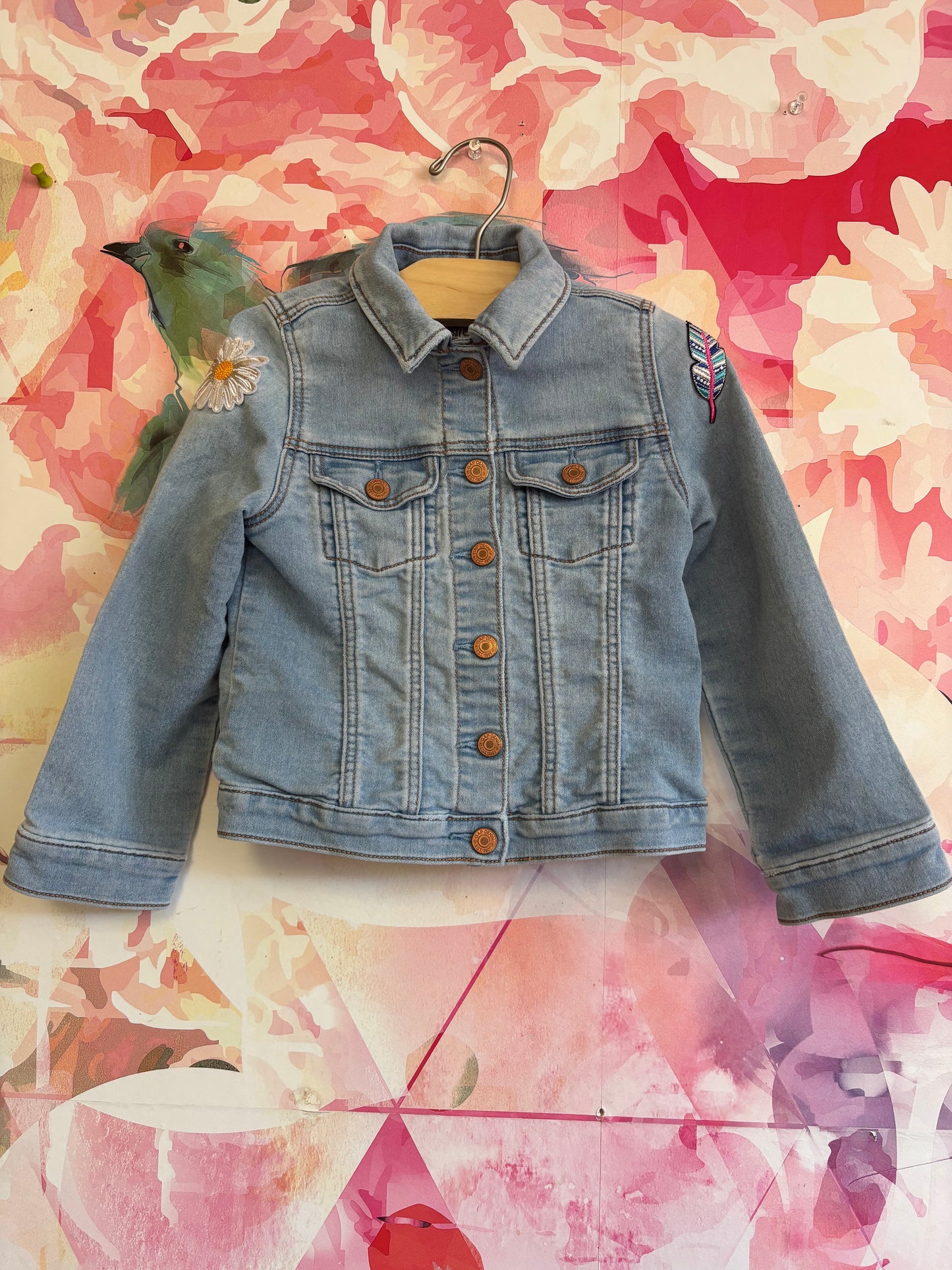 Baby Gap light blue denim jacket with sunflower and feather patches on sleeves. Snap closure. Size 5T