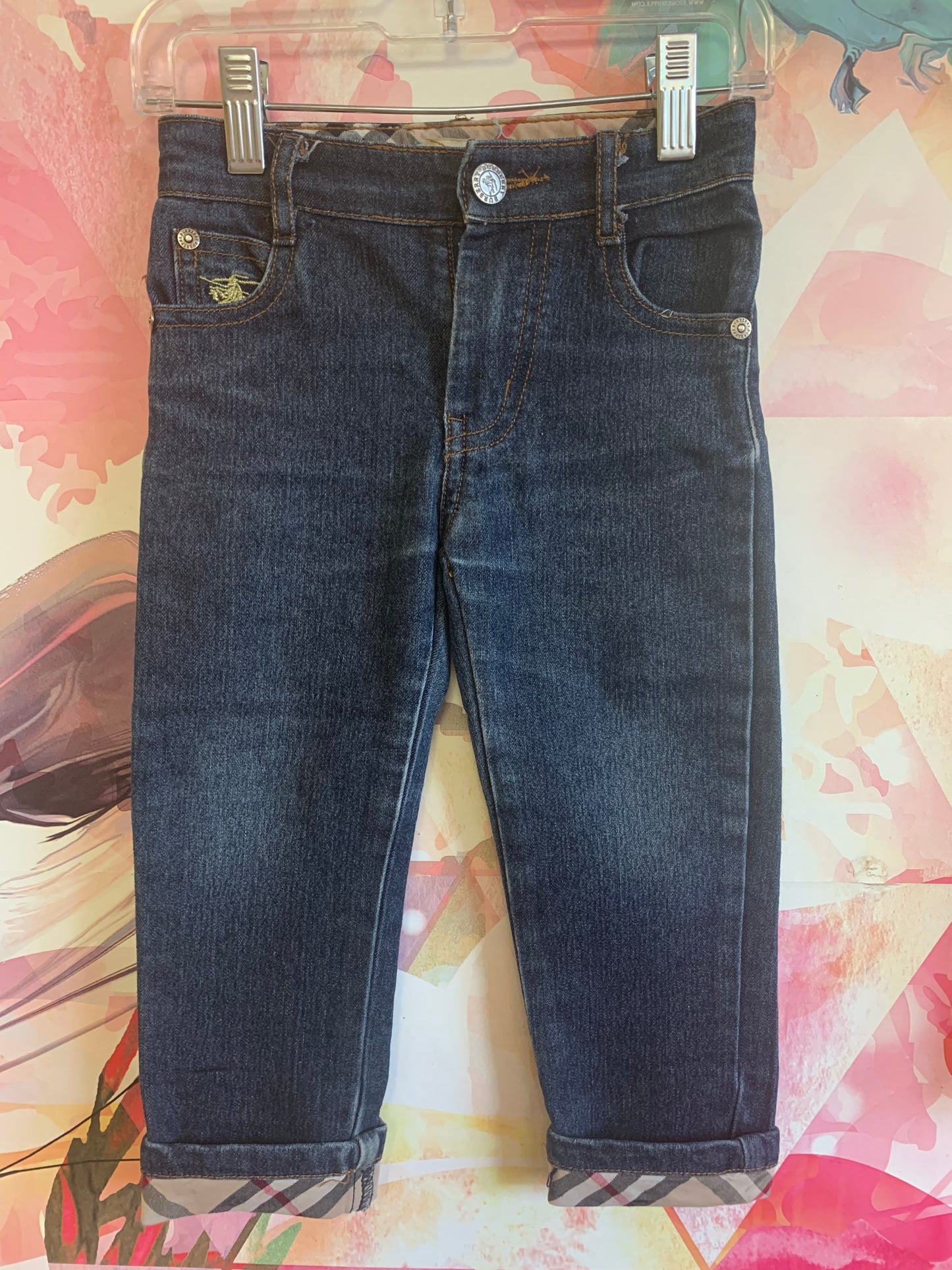 Burberry blue jeans with plaid rolled cuffs and detail on back pockets, inner waistband. Size 3/4T.