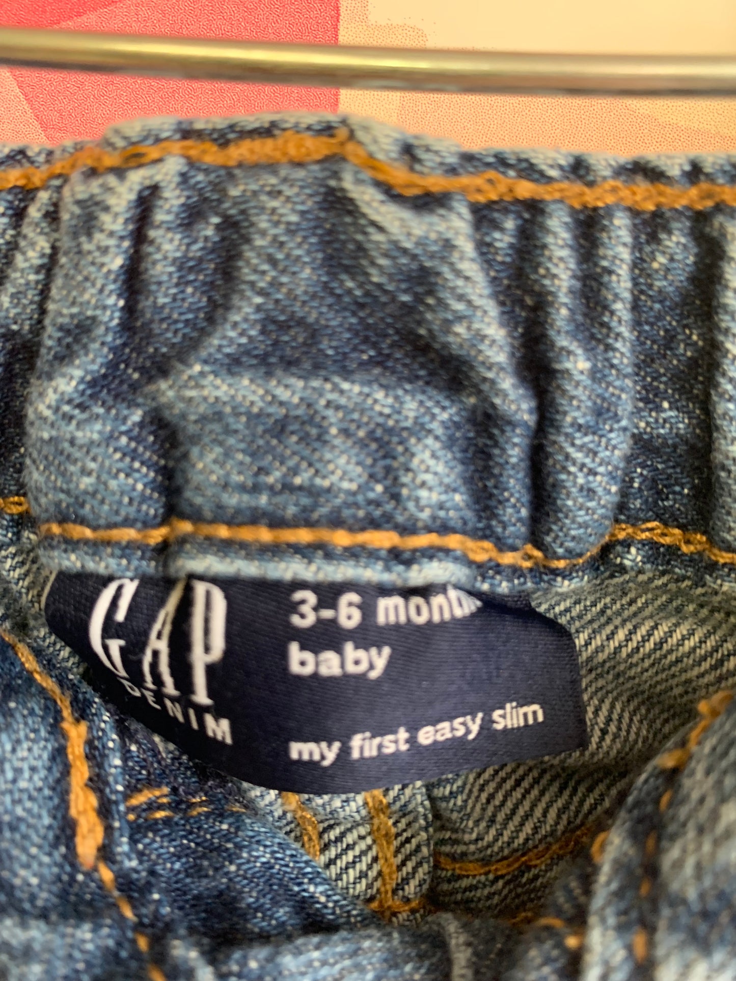 Baby Gap blue jeans with distressed knees and snap waist. Size 3-6m.