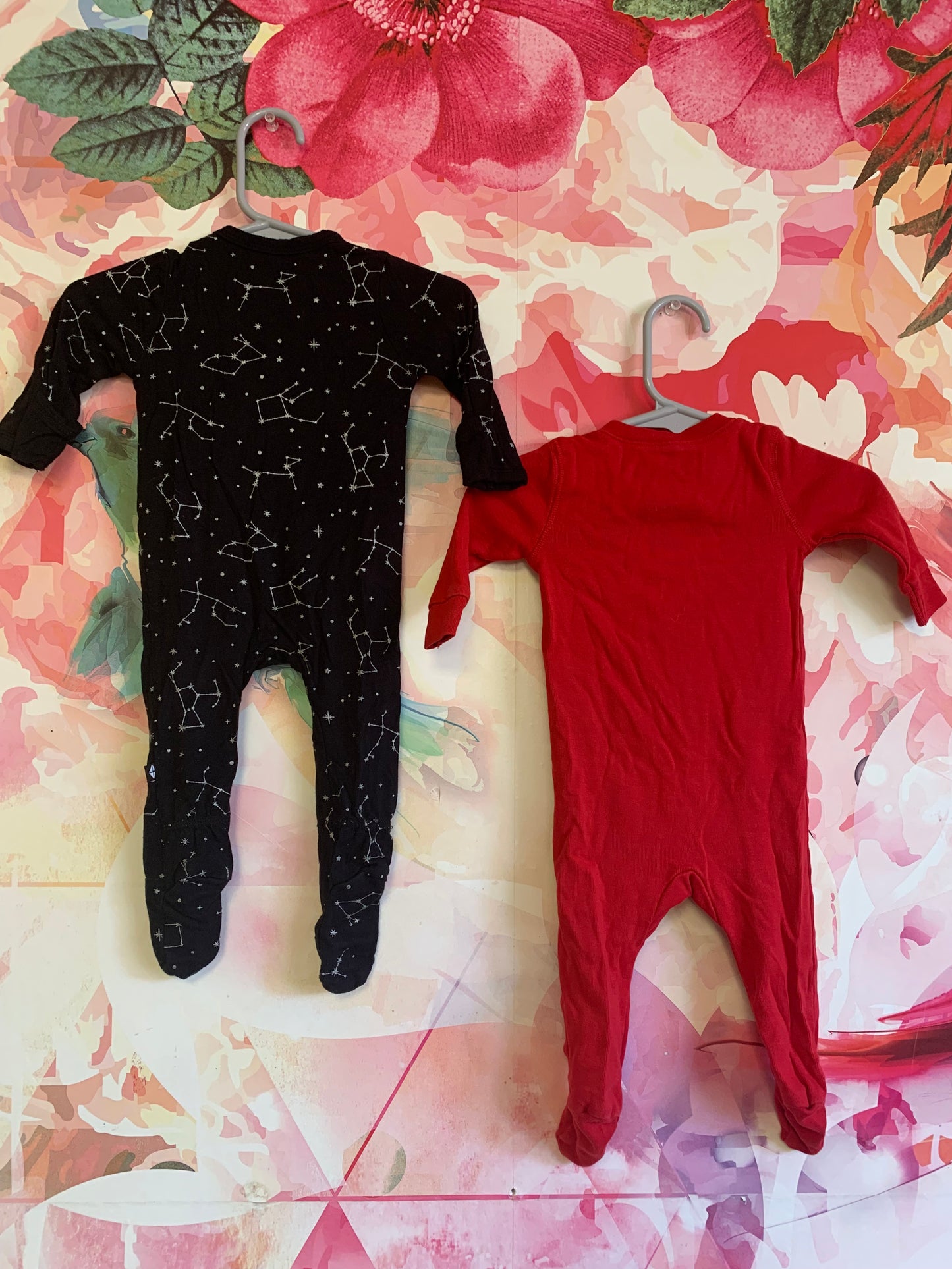 Kyte Black long sleeve romper with white constellations. Primary Red long sleeve romper. Size 0-3m