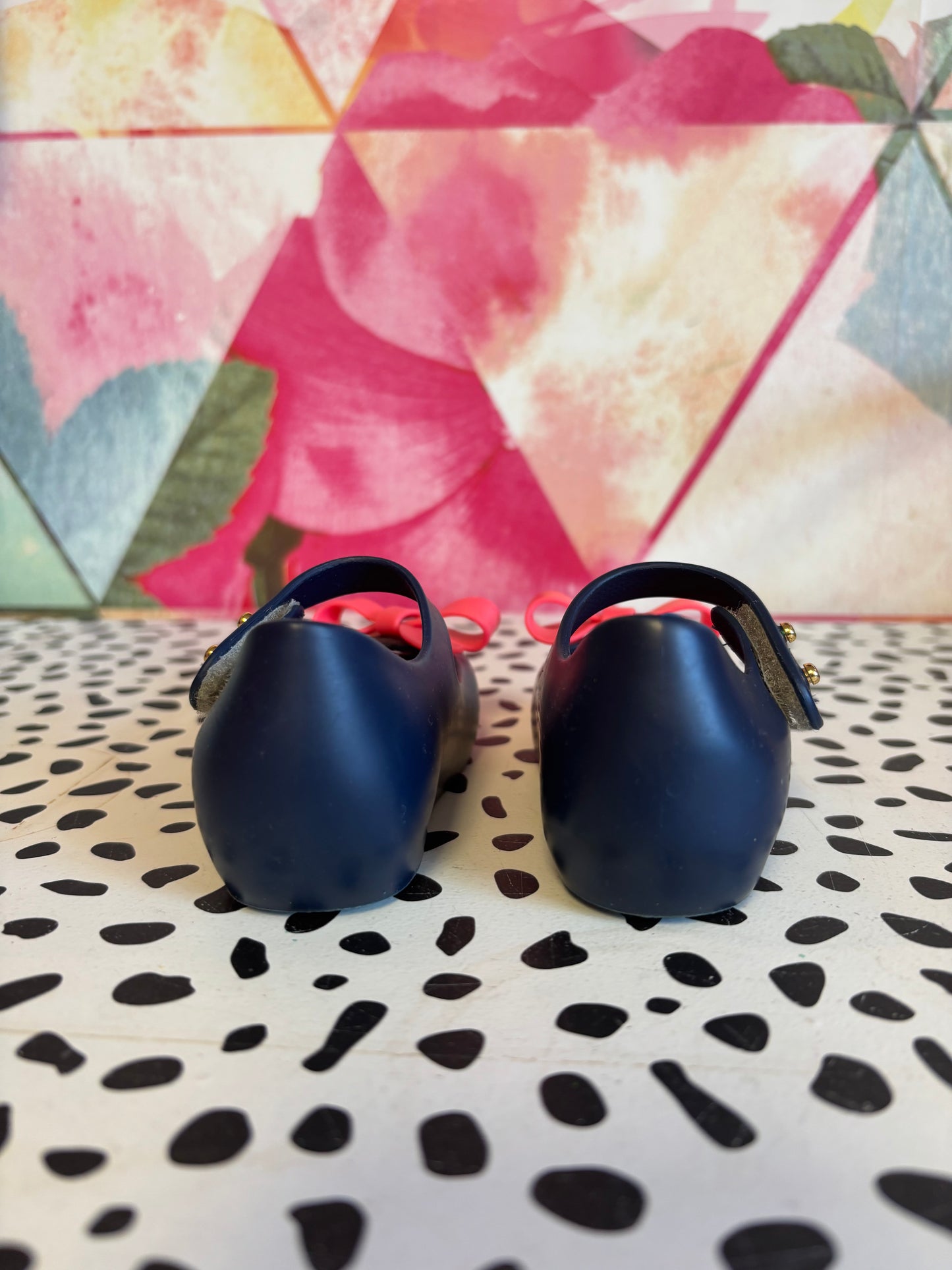 Mini Melissa blue shoes with Velcro strap & bright pink bow. Size 6.