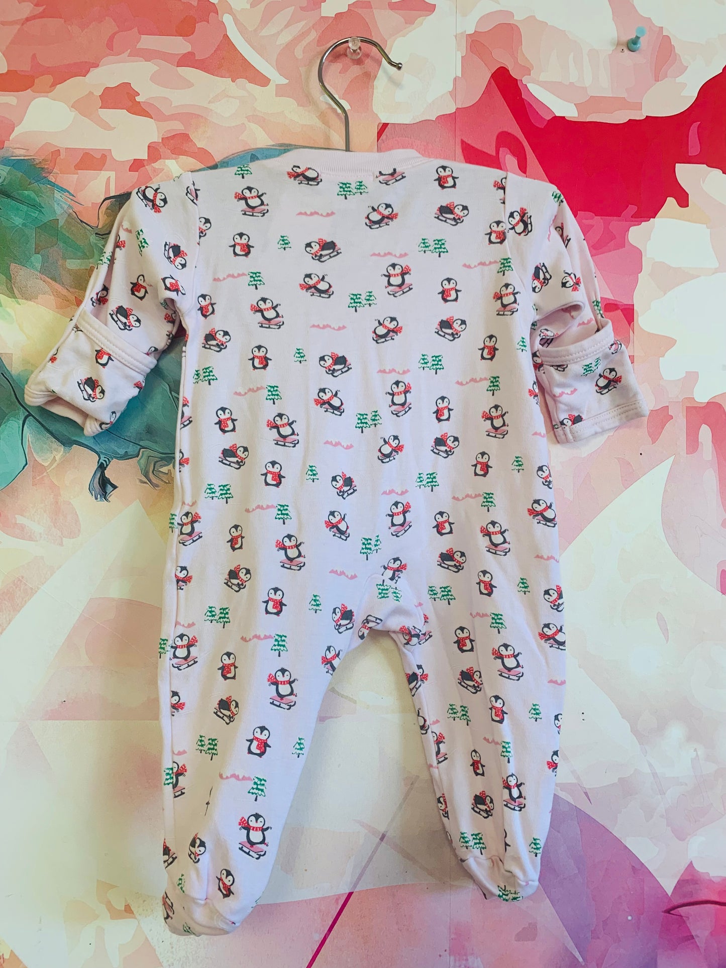 kissy kissy pink long sleeve romper with penguins & snowy pine trees. Size Newborn.