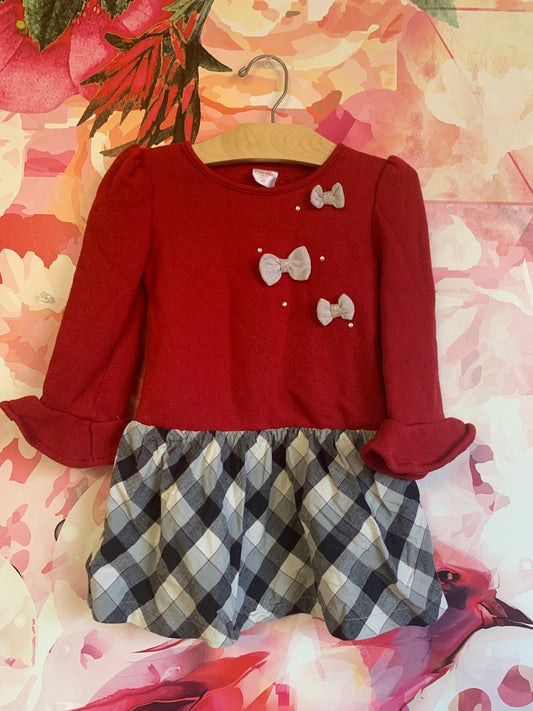 Fiorella dress. Red fleece top & black, white, red checkered skirt. 3 silver bows on top. Size 4T