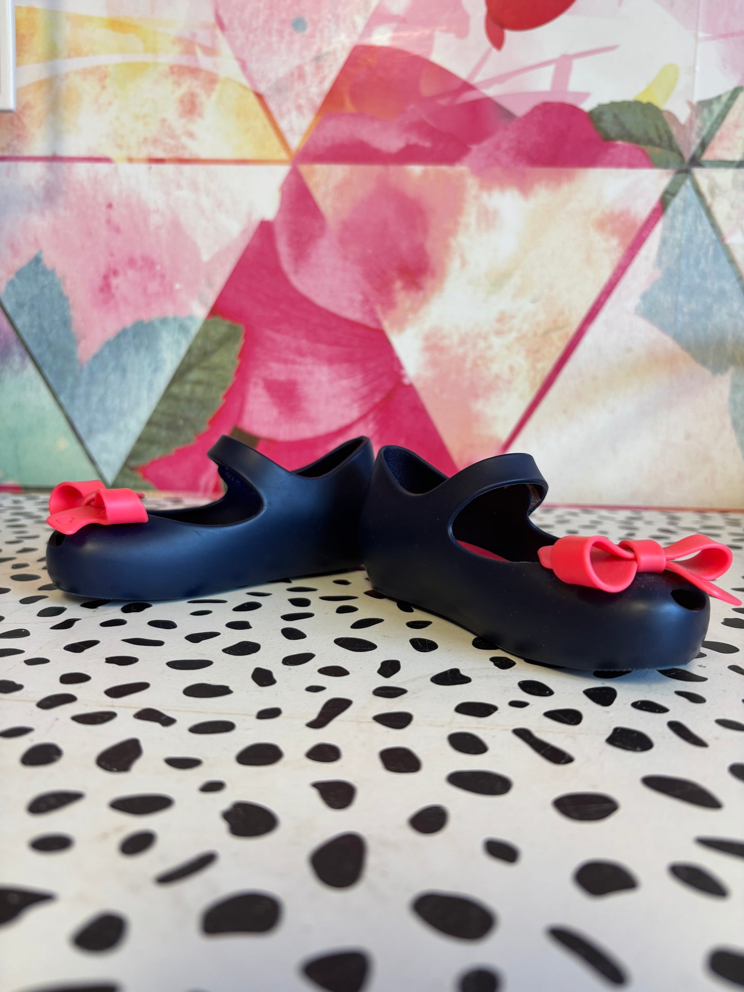 Mini Melissa blue shoes with Velcro strap & bright pink bow. Size 6.