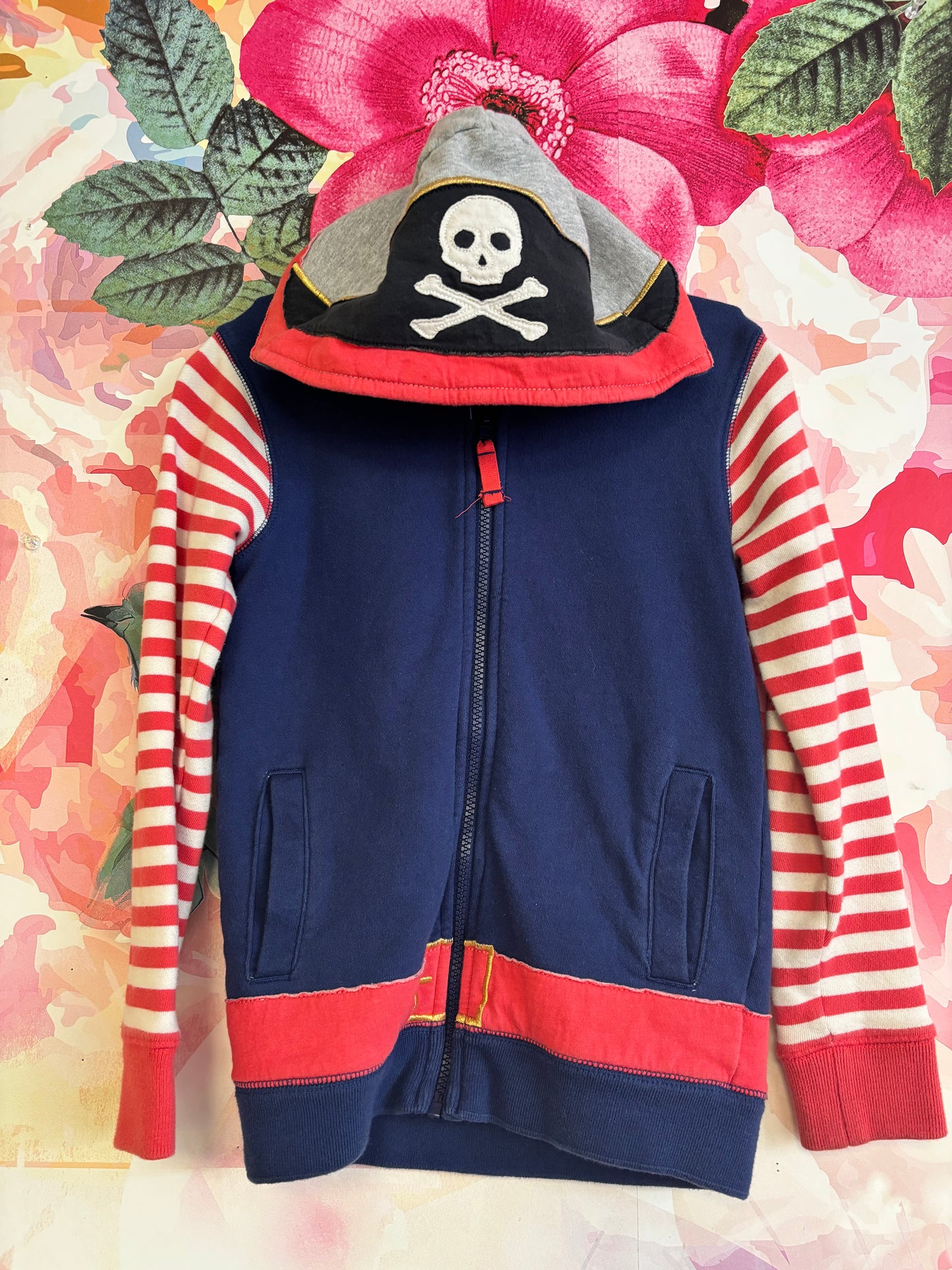 Mini Boden blue zip up pirate hoodie with red/white stripe sleeves, sword on back. Size 7/8