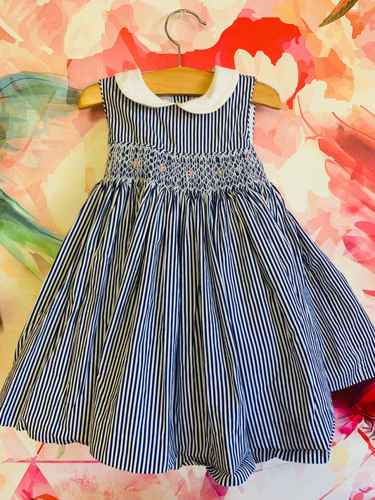 Ralph Lauren blue & white striped 100% cotton smocked dress. Full skirt, Peter Pan collar, waist bow tied in back. Size 18m.