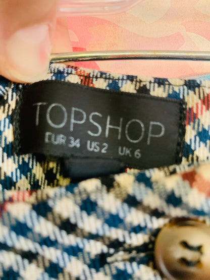 Topshop black, beige, red, blue houndstooth pants with belt loops, buckles, pockets & cuffed hem. Size 2.