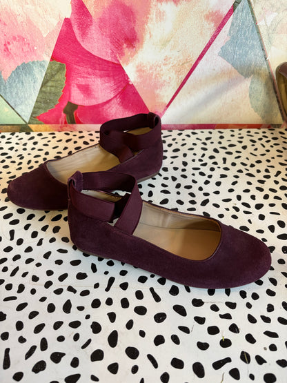 Elephantito purple suede leather Melissa flats. Luxe comfort ballerina shoe that features crossed stretch ankle straps for a secure fit. Lightly padded footbed leather outsole & lining. Size 3.