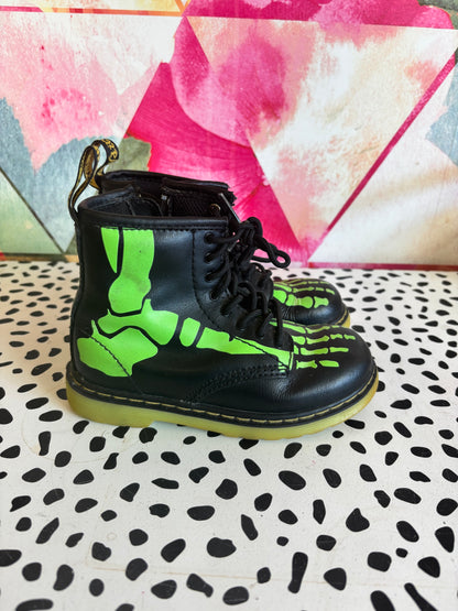 Doc Martens black leather boots with glow in the dark neon green skeleton foot bones. Size 10.