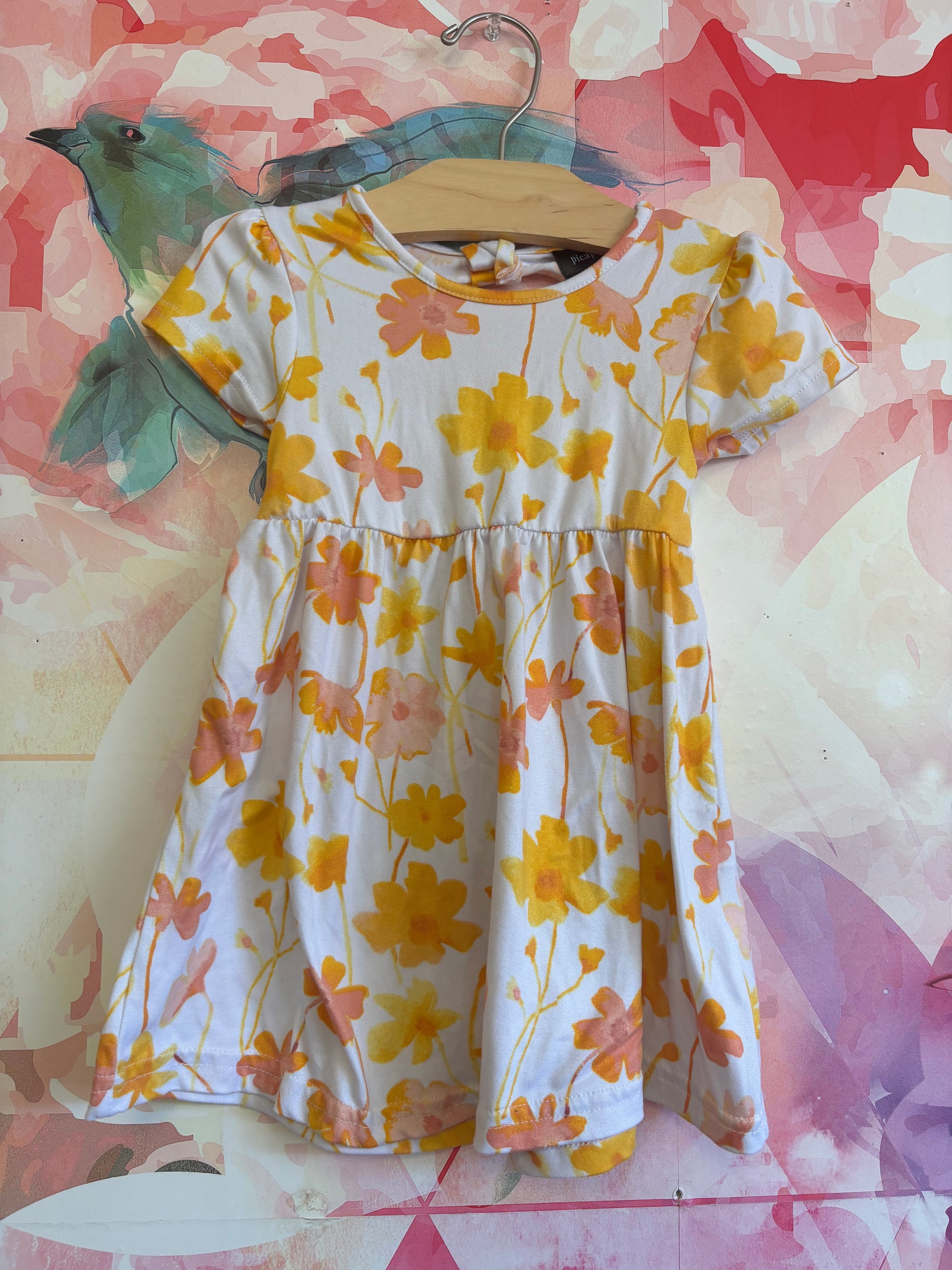 Picapino White dress with yellow & pink flowers. Cap sleeves and small cutout on back. Size 18-24m